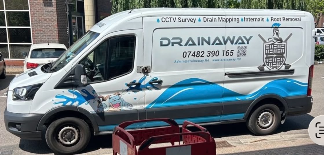 A DrainAway van, its side panel listing CCTV surveys, drain mapping, internals and root removal